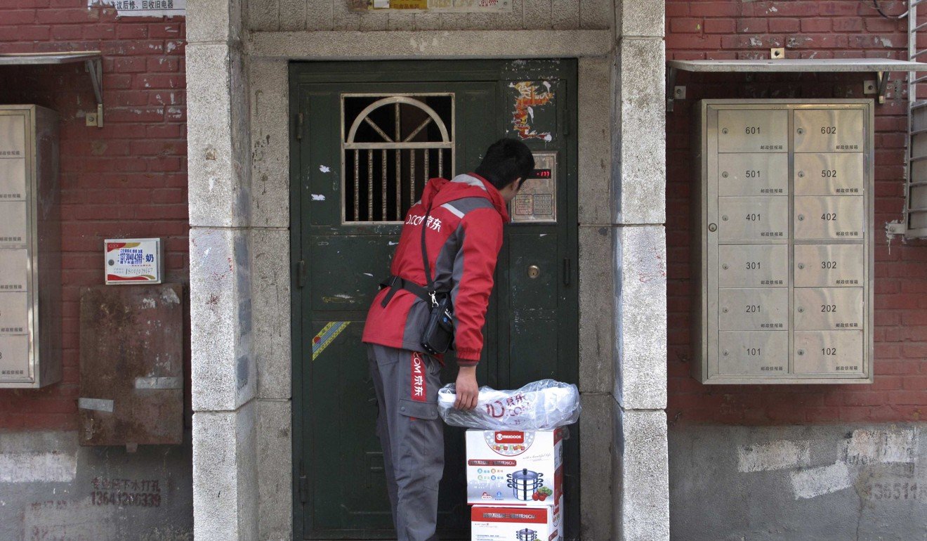 A JD.com delivery in Beijing. The company is looking to expand fresh food online buying and delivery beyond China’s top cities. Photo: Reuters
