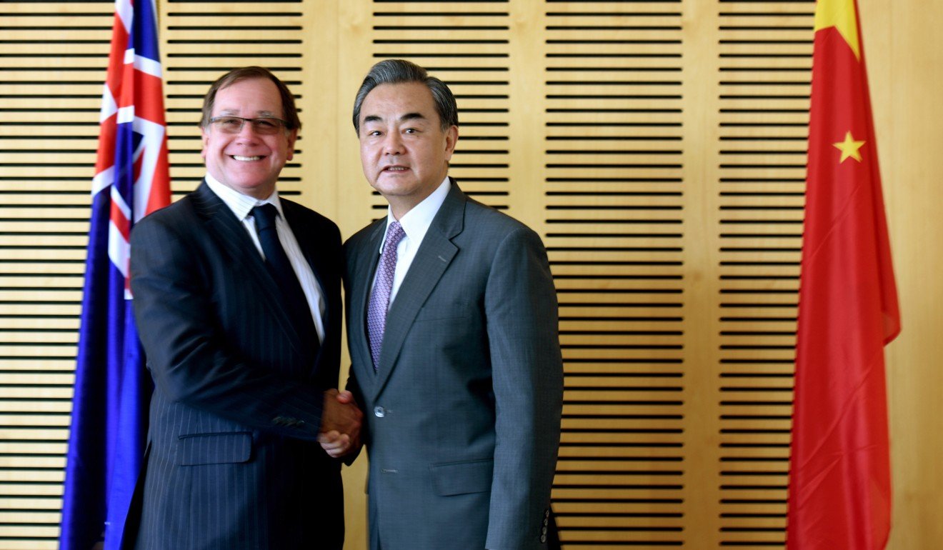 New Zealand Foreign Minister Murray McCully shakes hands with Chinese Foreign Minister Wang Yi during talks in Auckland earlier this year. Photo: Xinhua