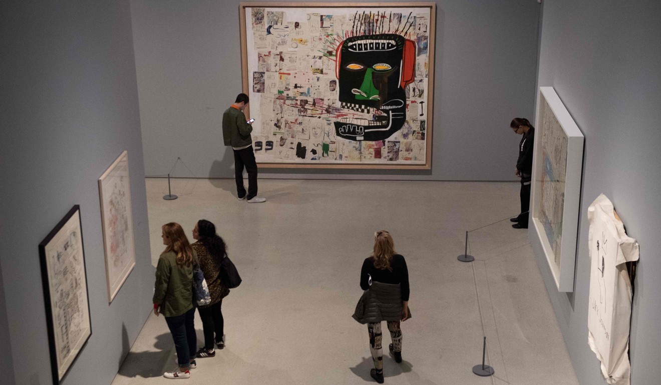 Basquiat’s works on display at the Barbican, with ‘Glenn’ (1984) on the far wall. Photo: AFP
