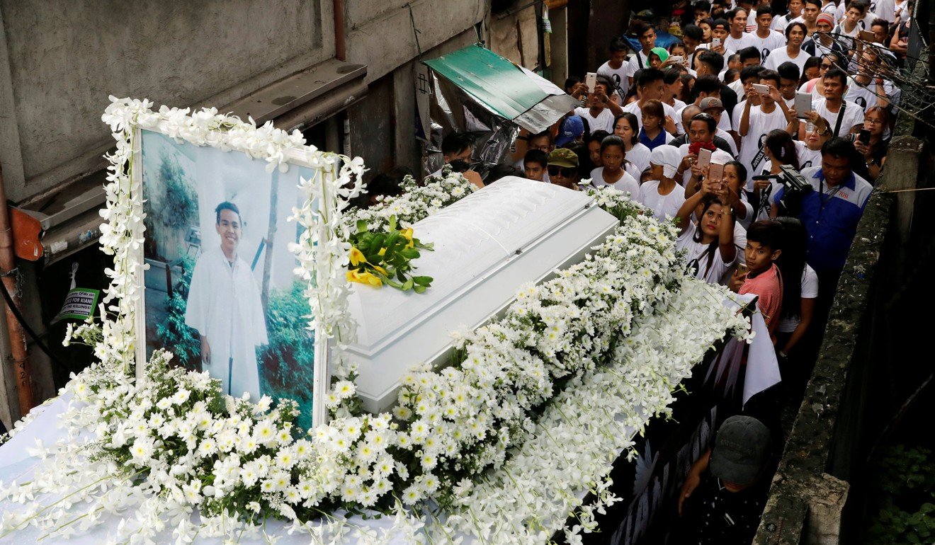Mourners take part in the funeral march of Kian Delos Santos, a 17-year-old who was shot during anti-drug operations in Manila last month. Photo: Reuters