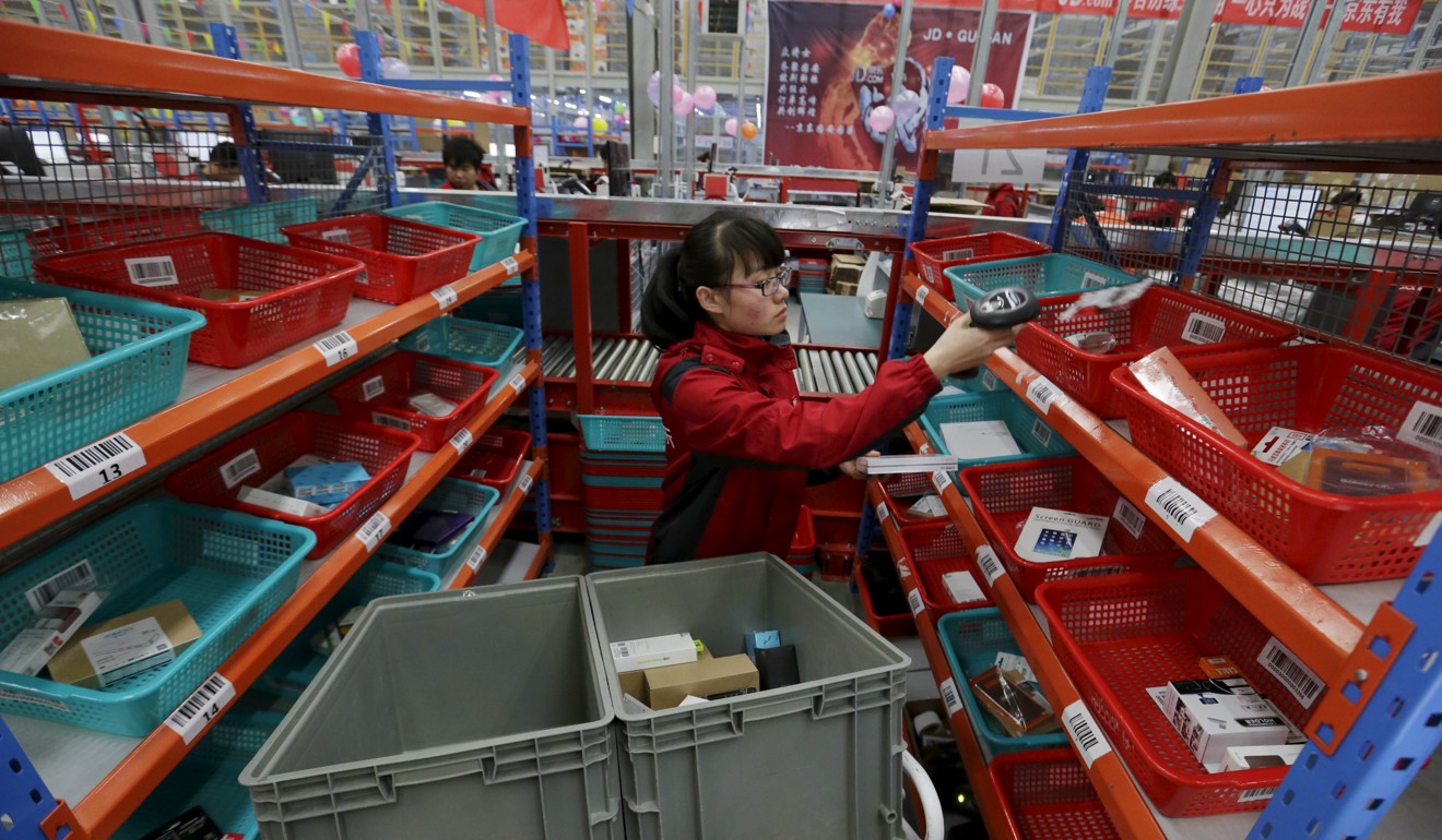 An employee works at a JD.com logistic centre in Langfang, Hebei province. Photo: Reuters