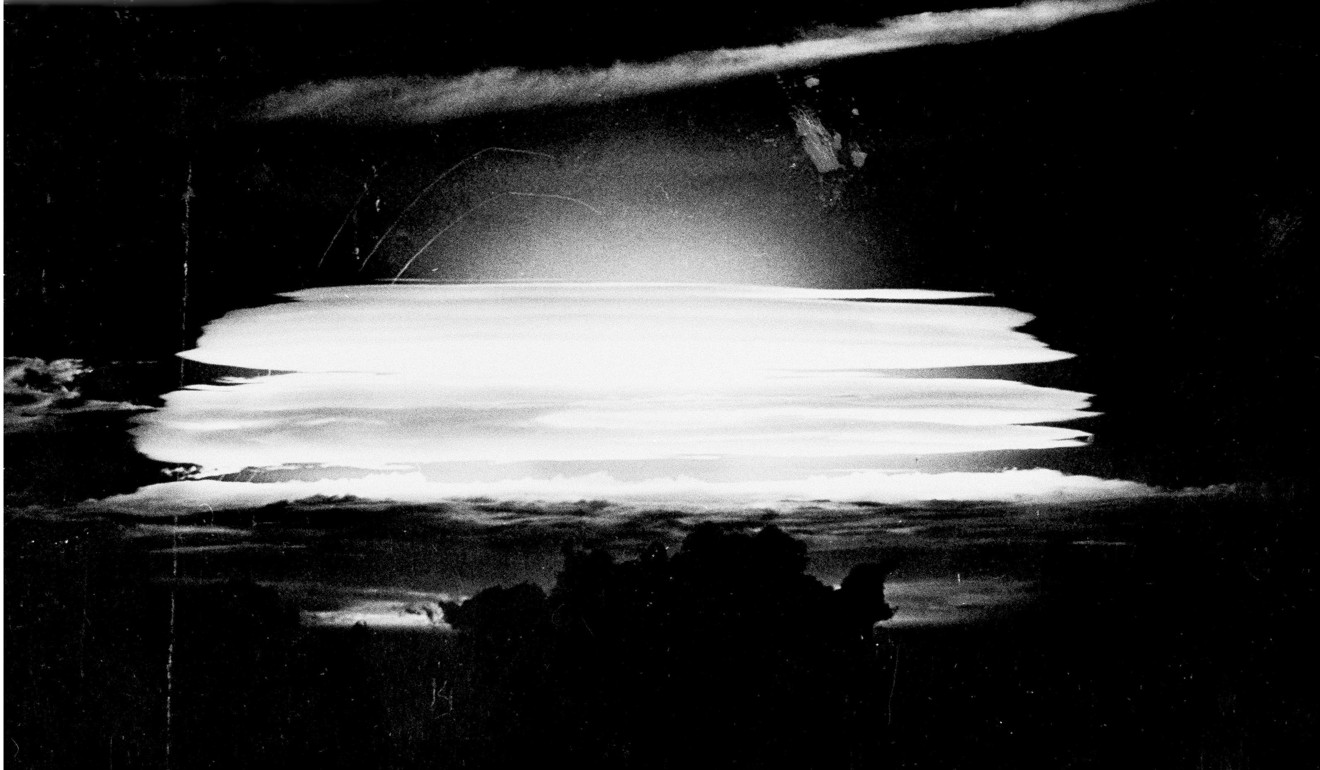A fireball lights up the sky at dawn near Bikini Atoll in the Pacific after a hydrogen bomb was dropped in a US test, in this May 20, 1956 photo provided by the Atomic Energy Council. North Korea has threatened to conduct an atmospheric nuclear test in the Pacific. If it does, Trump would go down in history as the president who allowed atmospheric nuclear testing to resume on his watch. Photo: AP / Atomic Energy Council