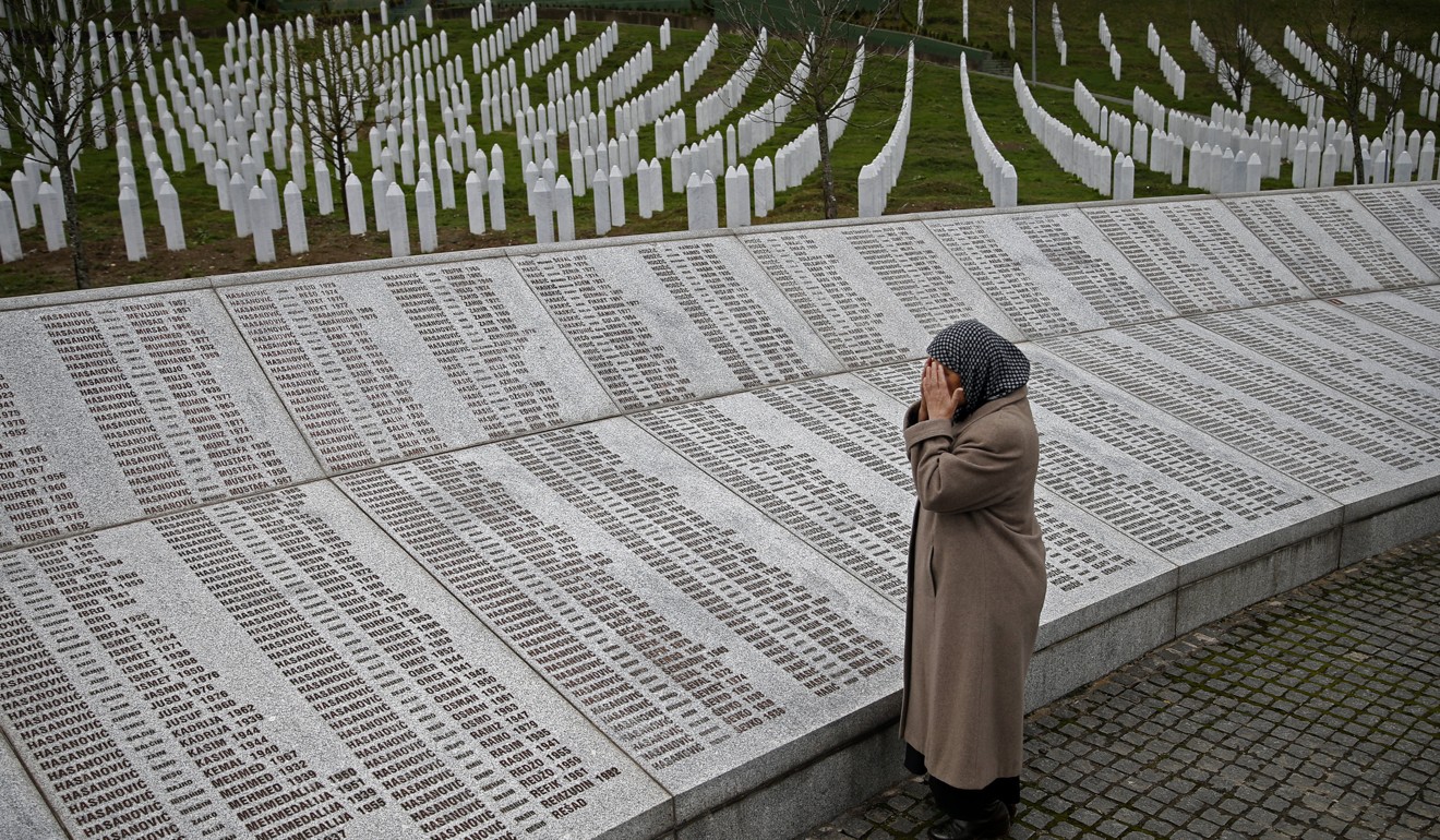 A Muslim woman who lost many members of her family prays near the memorial plaque for the victims of the Srebrenica massacre, on March 24 last year. More than 7,000 Muslim men and boys were massacred by Bosnian Serbs in July 1995 near Srebrenica, in Bosnia and Herzegovina, during the Yugoslavian civil war. Photo: Reuters