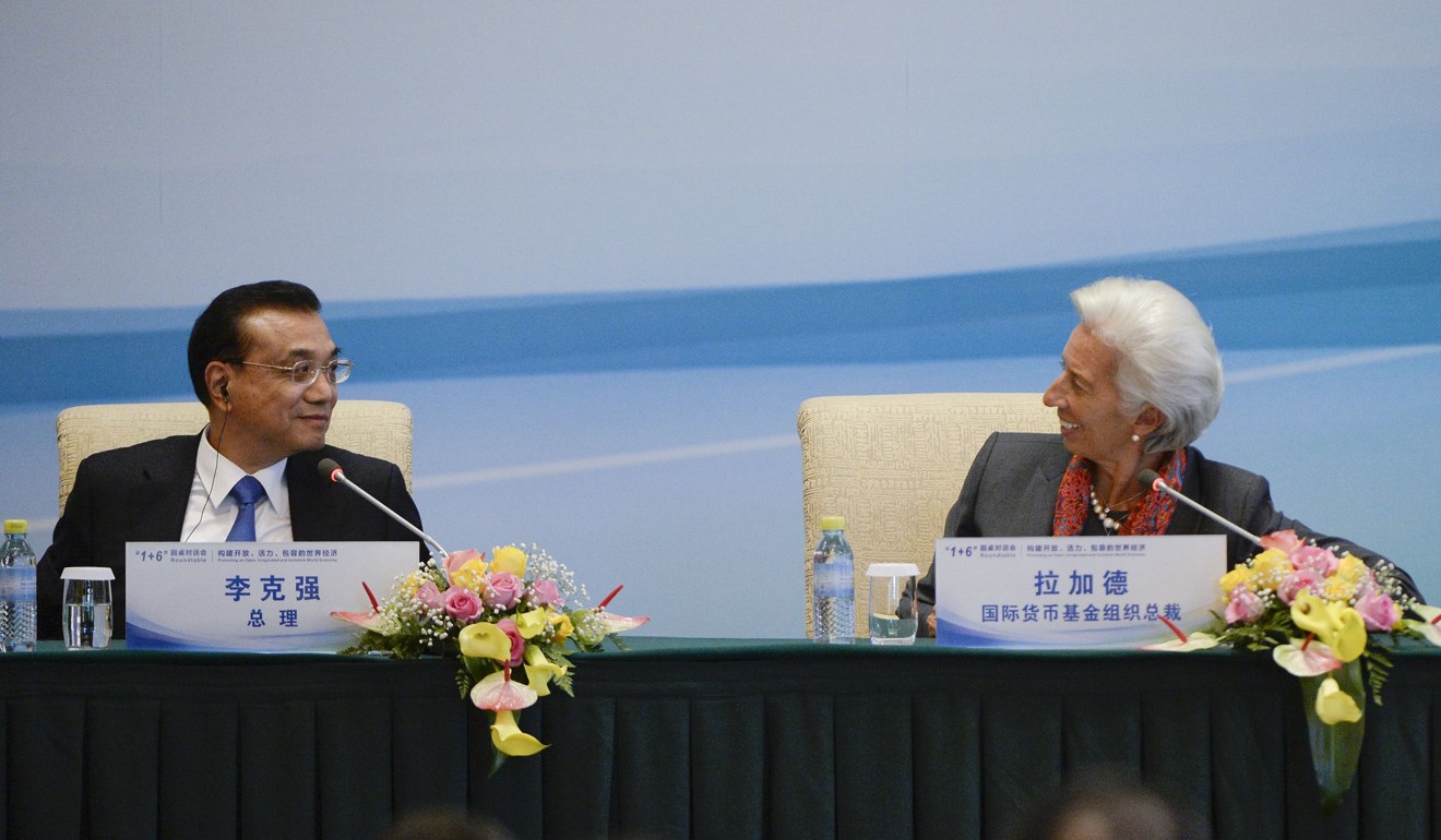 IMF Managing Director Christine Lagarde talks with Chinese Premier Li Keqiang (L) during a press conference following the 1+6 Round Table Dialogue meeting at the Diaoyutai State Guesthouse in Beijing on September 12, 2017. Photo: AFP