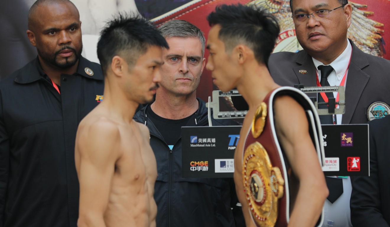Rex Tso (right) and Kohei Kono face off at the official weigh-in.