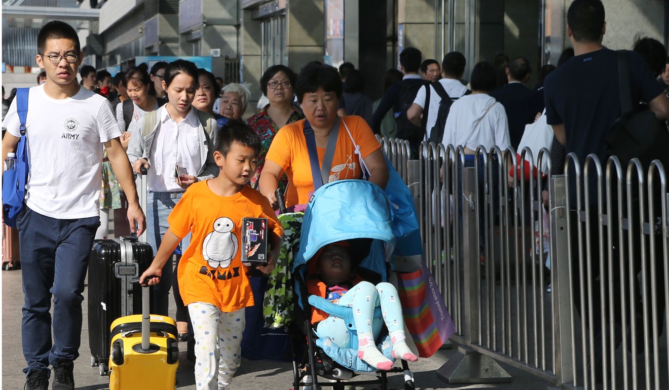 Passengers at the Hongqiao Railway Station in Shanghai. The government said it would relax regulations in the online holiday home rental and car rental industries in a bid to boost tourist spending. Photo: Xinhua