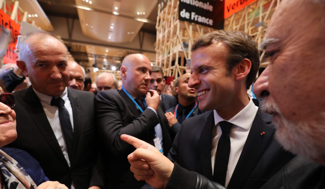 French President Emmanuel Macron visits the French pavilion after opening the Frankfurt Book Fair on October 10, 2017 in Frankfurt am Main, Germany. Photo: AFP