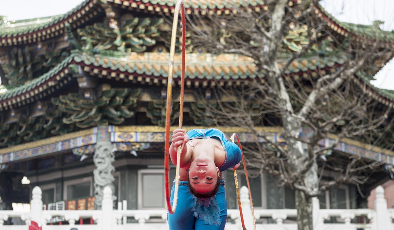 A Chinese hula-hooper performs in a celebration of the Lunar New Year in Yokohama Chinatown, Japan. Picture: Alamy