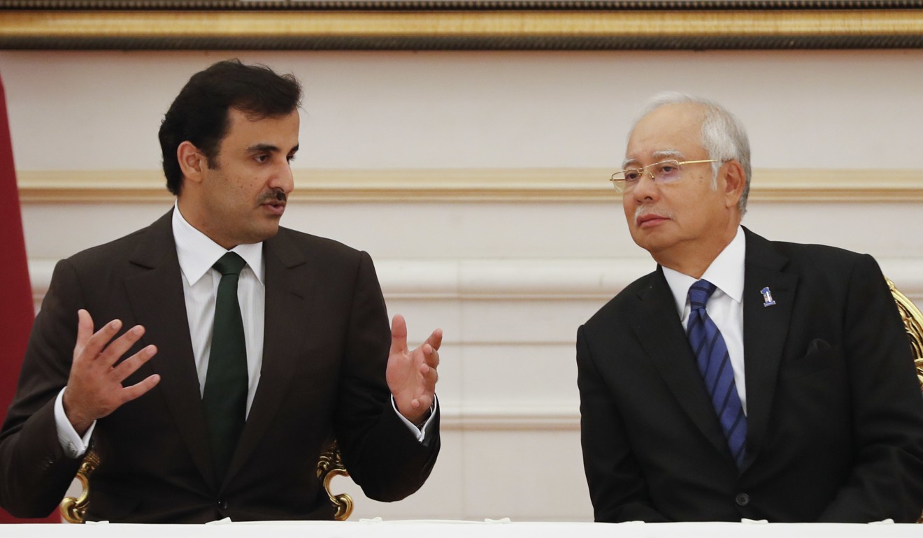 Sheikh Tamim with Najib during a signing ceremony of a memorandum of understand at the prime minister’s official residence in Putrajaya, Malaysia. Photo: AP