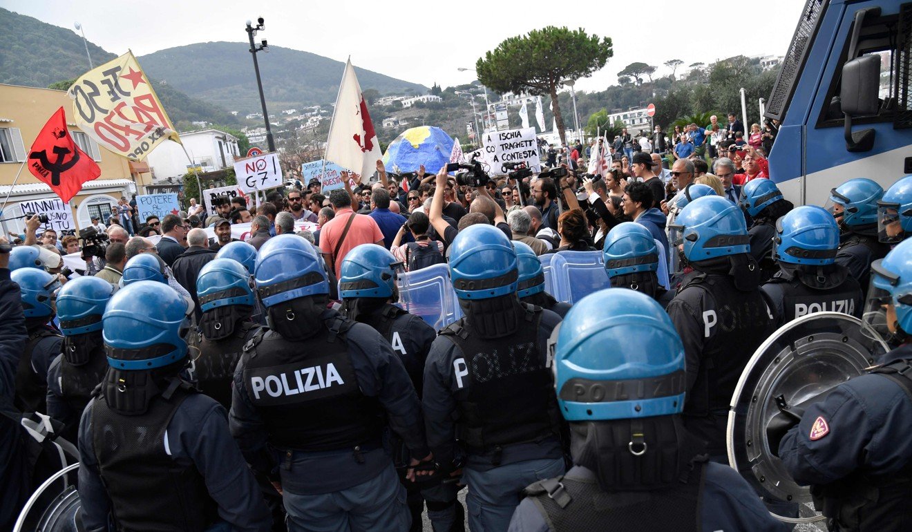 Riot police face anti-G7 protesters on Ischia. Photo: AFP