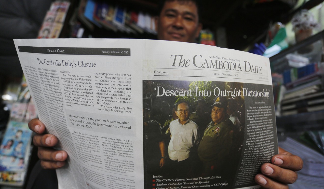 A man reads the last Cambodia Daily at a bookstore in Phnom Penh on September 4. The Cambodian government closed the paper, ostensibly because of its outstanding tax bill, though the paper says it is part of a broader crackdown on dissent. Photo: EPA