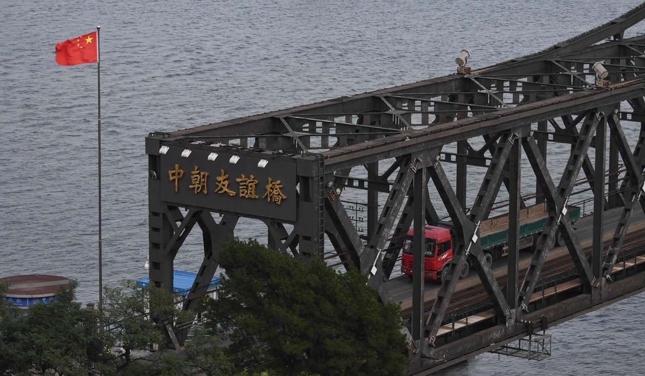 A file picture of trucks entering North Korea from the Chinese border city of Dandong. Photo: AFP
