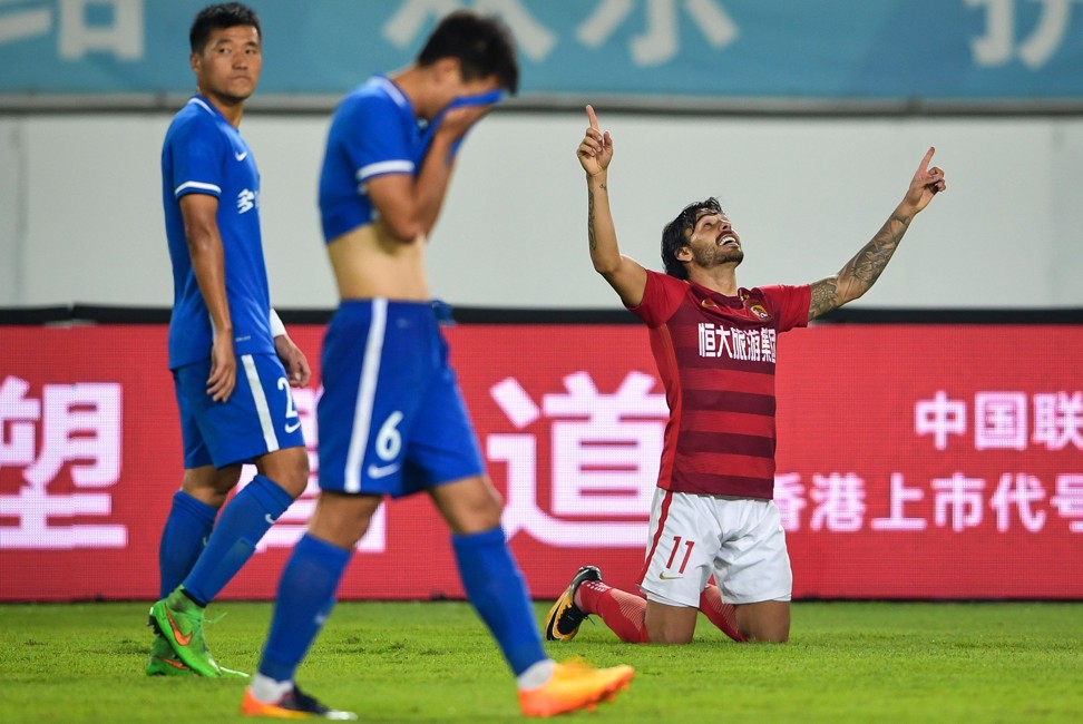 Ricardo Goulart celebrates scoring against Guizhou Zhicheng. Photo: AFP