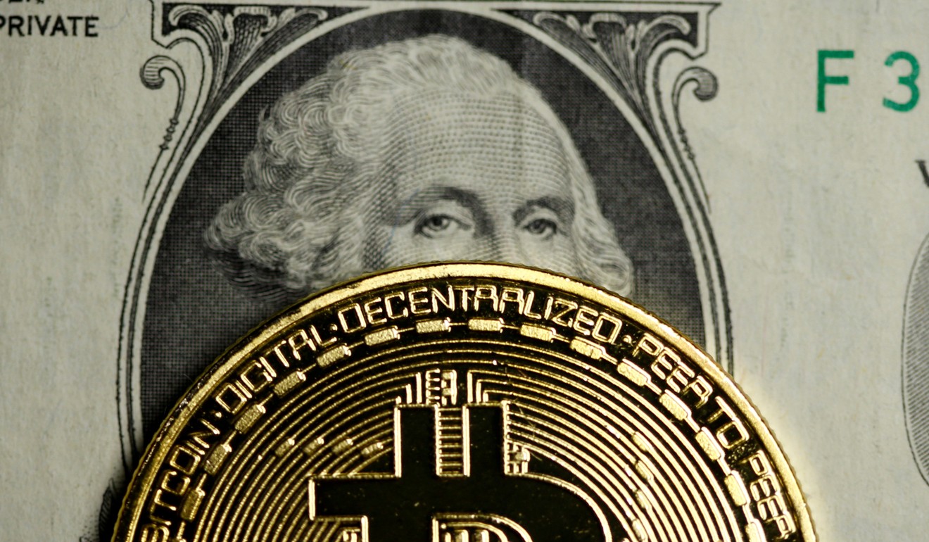 A bitcoin and dollar note are seen in this illustration picture. Photo: Reuters