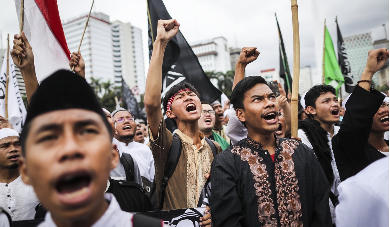 Muslims protest against Jakarta's governor Basuki Tjahaja Purnama earlier this year, before he was jailed in May on shaky claims that he insulted the Kuran during his election campaign. Photo: EPA