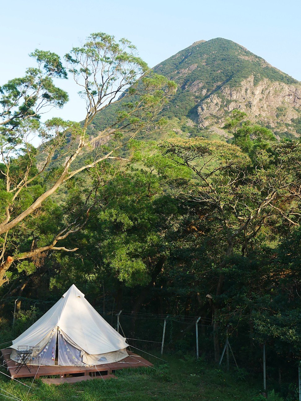 One of the glamping bell tents at YHA’s Ngong Ping campsite, with Lantau Peak in the background.Photo: Stuart Heaver
