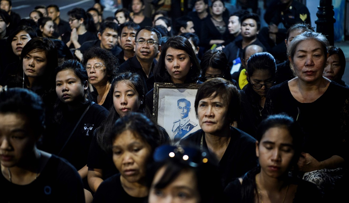 Mourners pray for the late Thai King Bhumibol Adulyadej. Photo: AFP