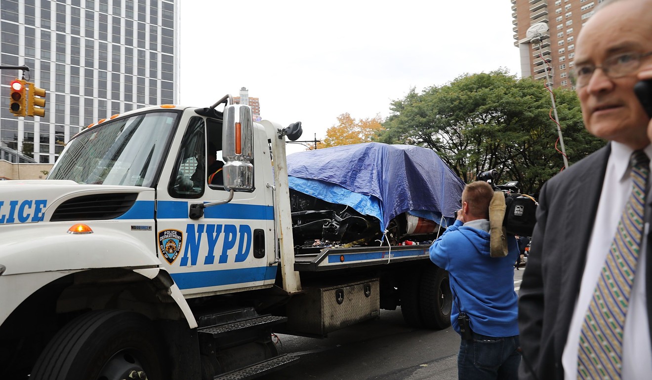 The crashed vehicle used in what is being described as a terrorist attack is moved away from the scene in lower Manhattan on Wednesday. Photo: AFP