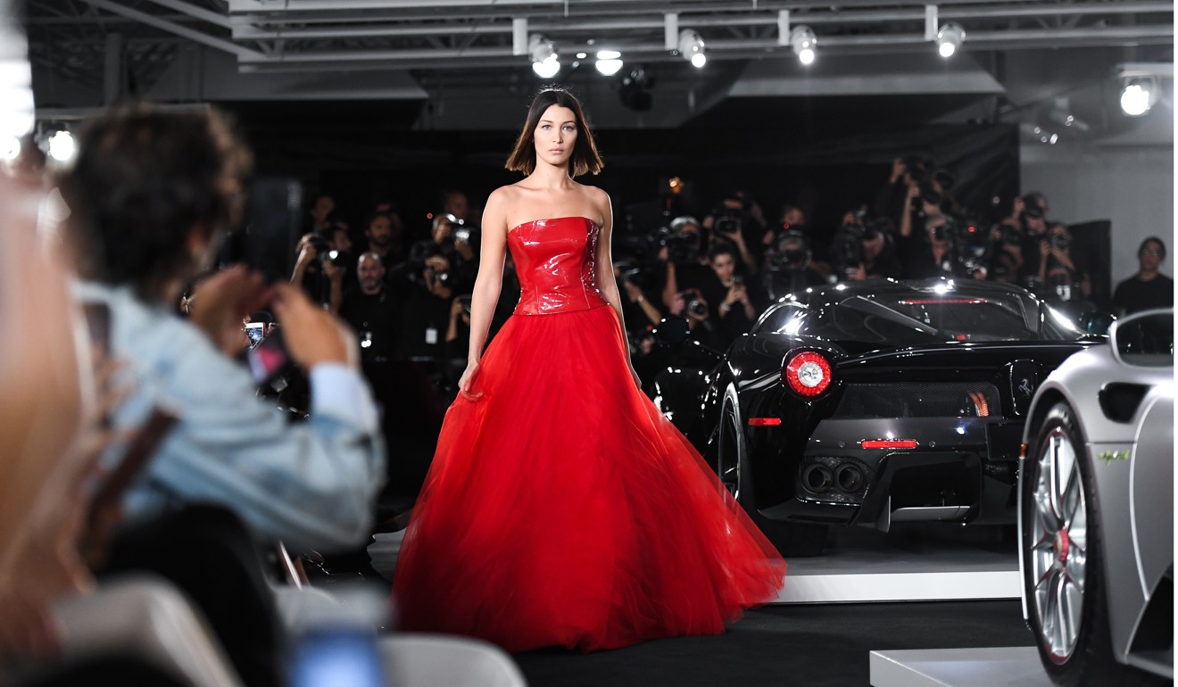 Bella Hadid presents a creation from the Ralph Lauren spring/summer 2018 collection in a show that was presented in Lauren’s private garage for New York Fashion Week.