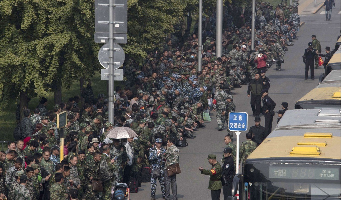 Thousands of veterans protest outside the Central Military Commission headquarters in Beijing in October last year. Photo: AP