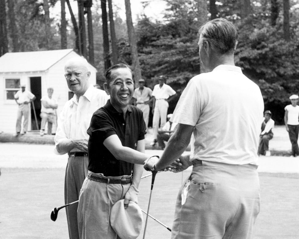 Then Japanese prime minister Nobusuke Kishi greets senator Prescott S. Bush, father of 1989-93 president George H. W. Bush, watched by then US president Dwight Eisenhower in Greenwich, Connecticut, in June 1957. Photo: AP