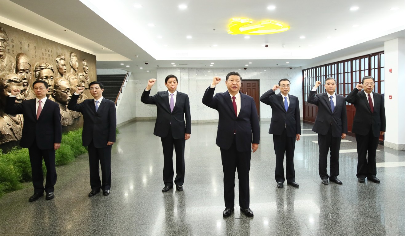 Xi Jinping and the six other members of the Politburo Standing Committee reaffirm their party oath on a visit to the site of the first party congress in Shanghai. Photo: Xinhua