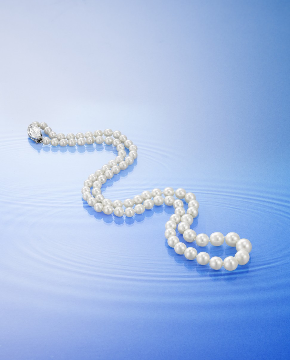 A Natural Pearl and Diamond necklace signed by Tiffany & Co, and dated 1910, features 81 graduated round to off-round natural pearls with the largest measuring 10.10mm diameter and is completed by a marquise-cut diamond weighing 2.97 carats.