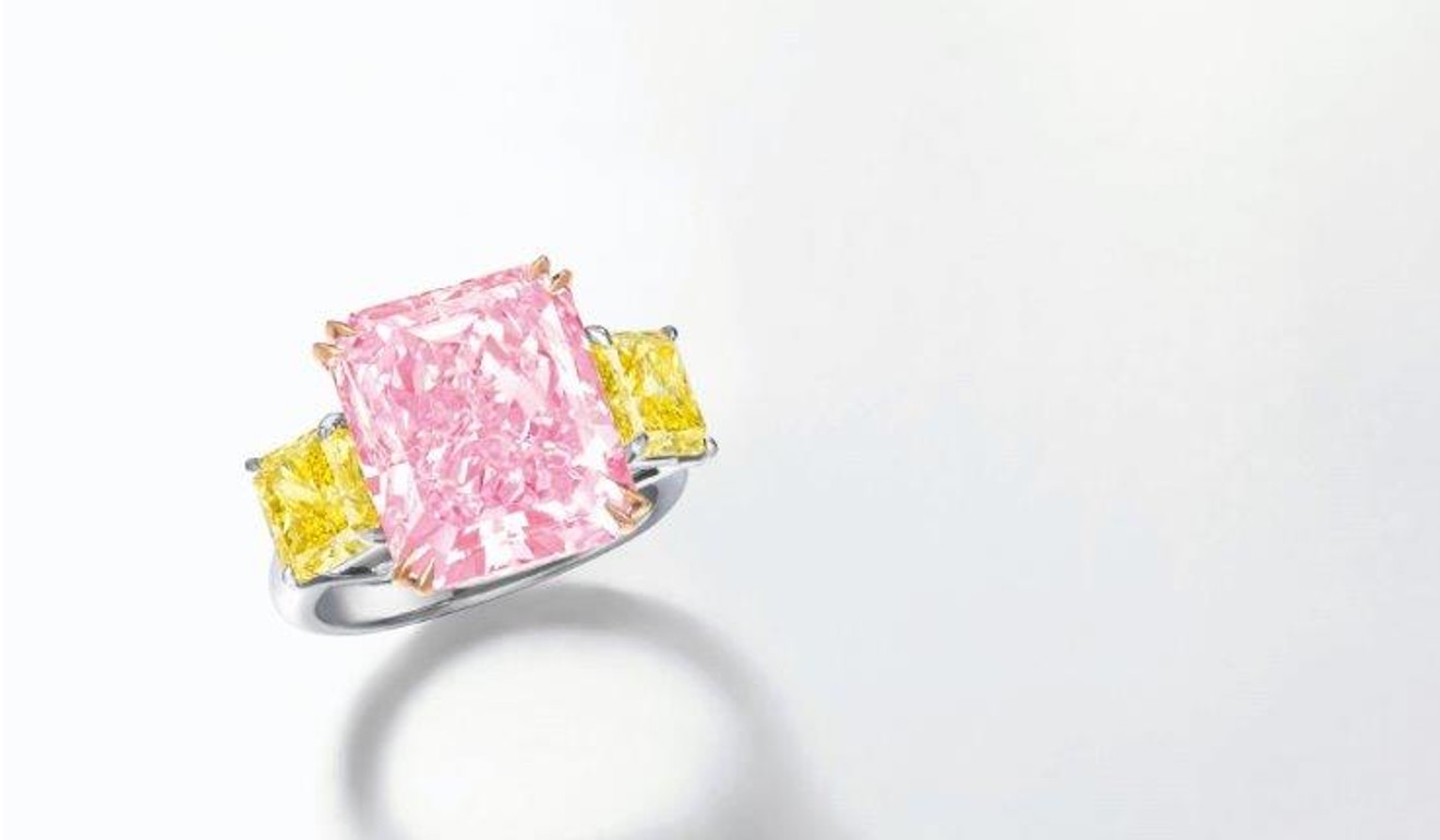 A 10.25 carat fancy intense purplish pink and fancy vivid yellow diamond ring by Ronald Abram.