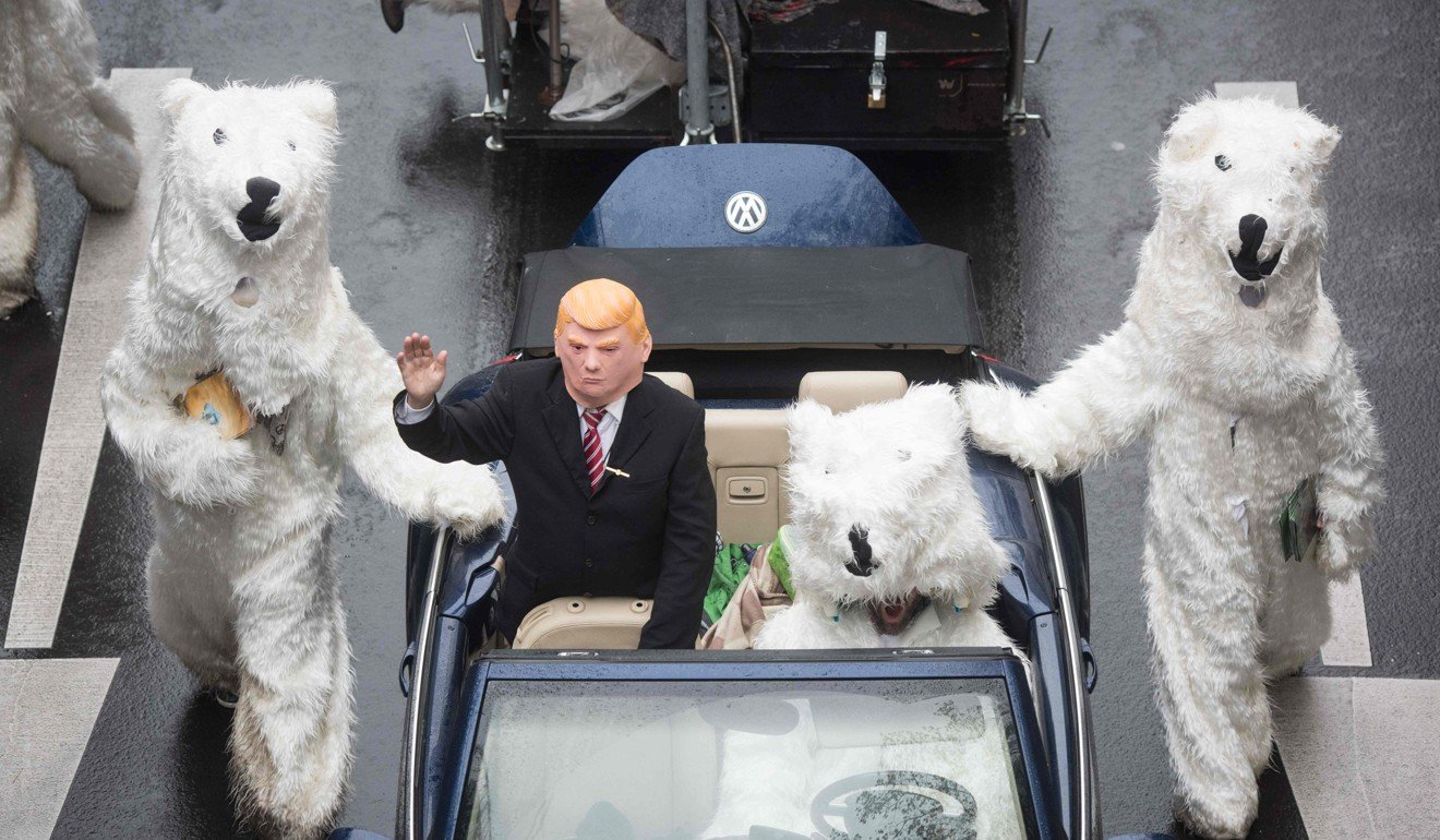 Demonstrators dressed as US President Donald Trump and polar bears at a protest outside the event in Bonn. Photo: AFP