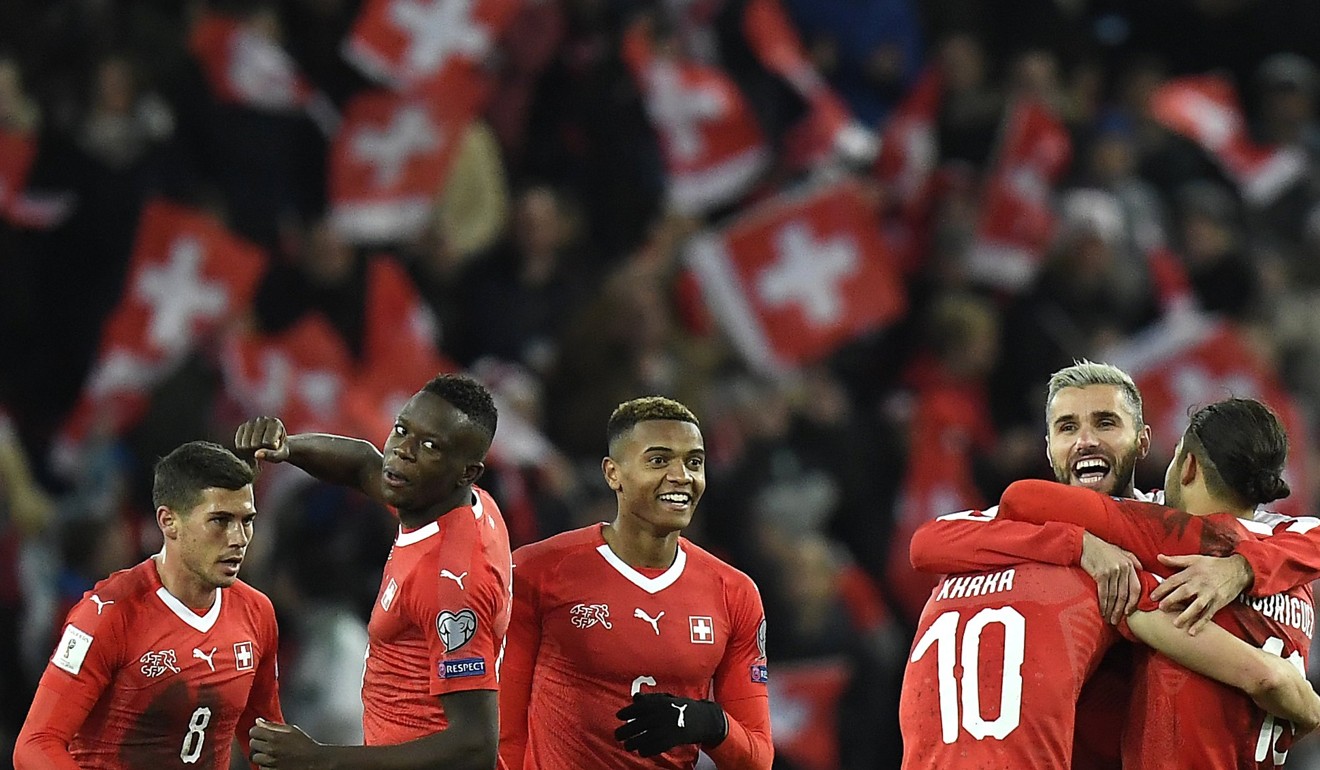 Switzerland’s players celebrate qualifying for the World Cup. Photo: EPA