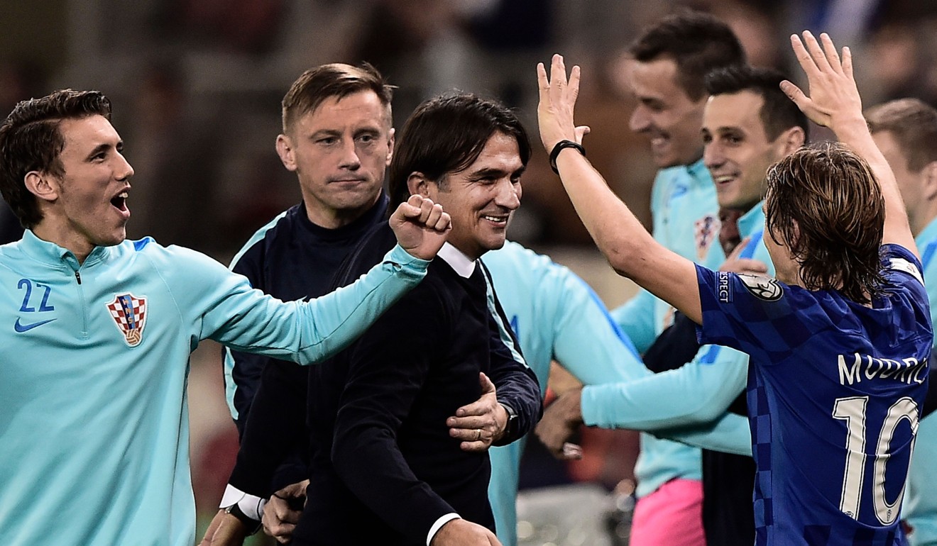 Croatia coach Zlatko Dalic (centre) celebrates with his team after they booked their spot in Russia. Photo: AFP