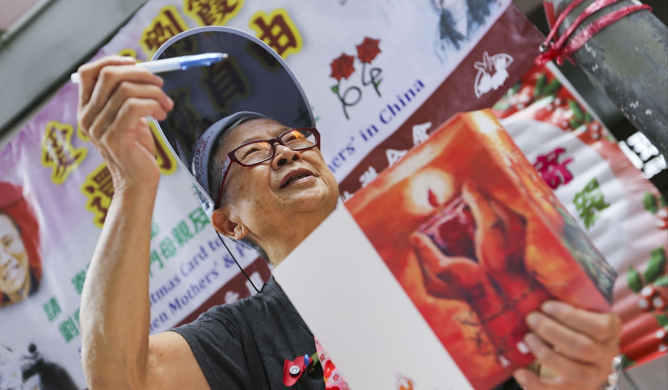 Ho Shui-che, a volunteer with the Alliance in Support of Patriotic Democratic Movements in China, invites passers-by to write Christmas cards to Liu Xia and Chinese dissidents in Causeway Bay, Hong Kong, on November 11. Liu Xia is the widow of Chinese dissident and Nobel Peace Prize Winner Liu Xiaobo, who died in July, nine years after his arrest for inciting subversion. China is currently ranked very low in indices relating to political freedom. Photo: Xiaomei Chen