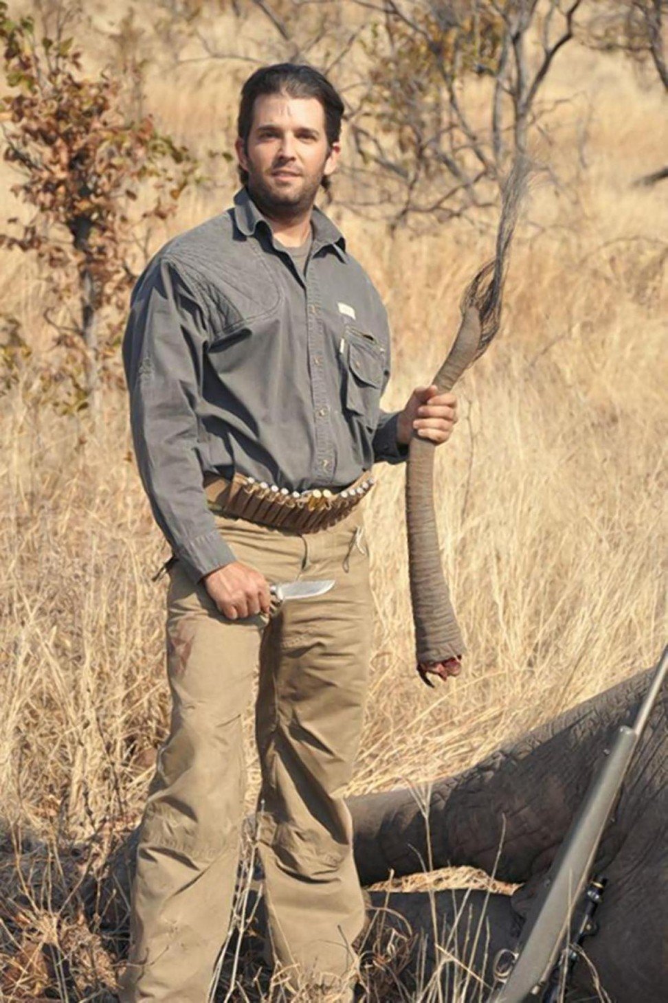 Donald Trump Jr. is seen with the tail of an elephant he killed during the 2011 hunting trip. Photo: Hunting Legends
