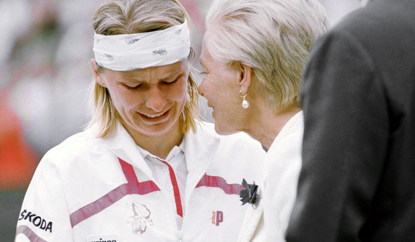 Jana Novotna breaks down and weeps as she accepts the 1998 Wimbledon runner-up trophy from the Duchess of Kent, in what became an iconic image. Photo; AP