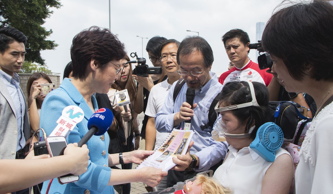 Carrie Lam meets Josy Chow, who suffers from spinal muscular atrophy. Photo: Kwong Wing-kin