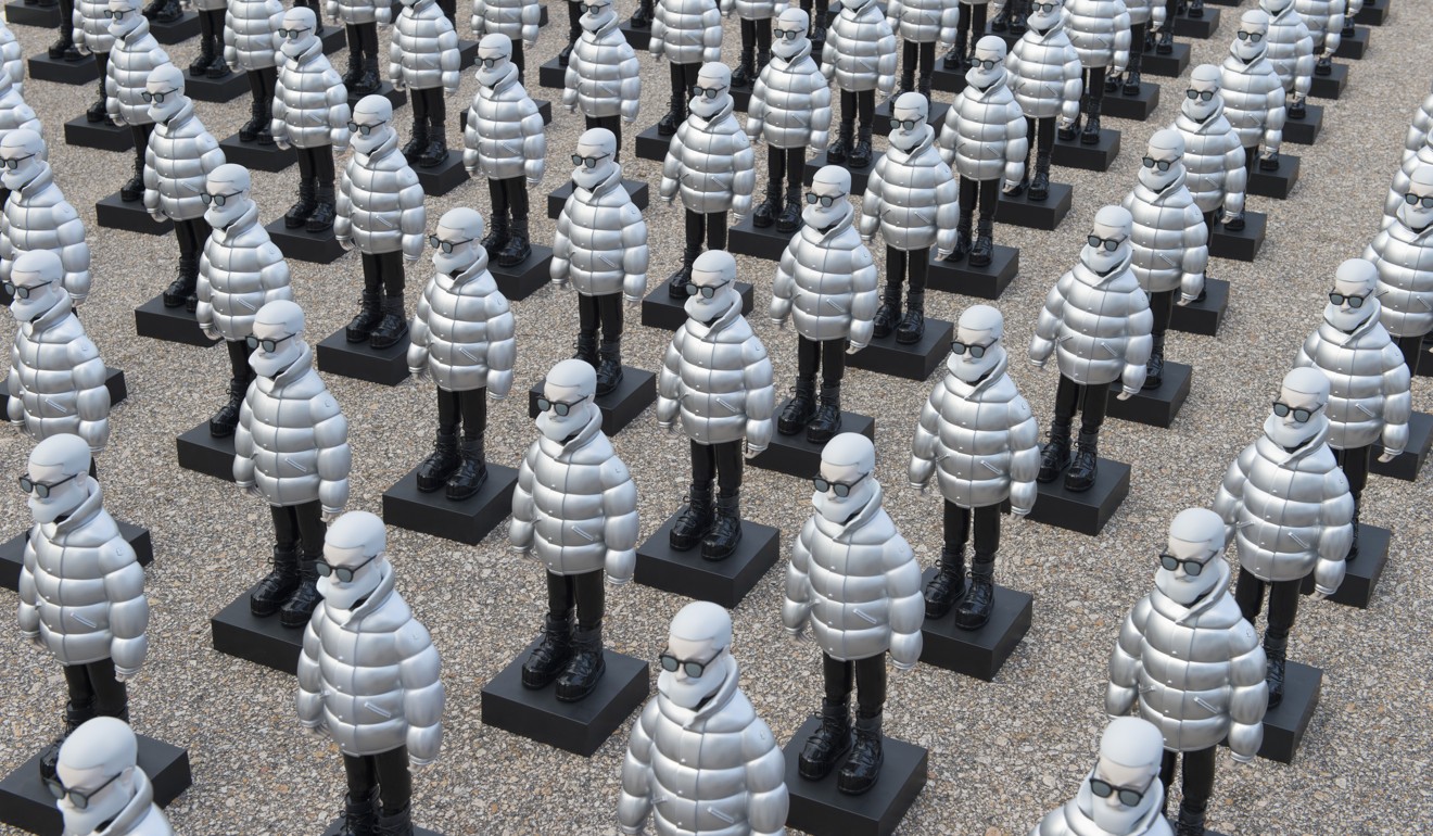 Mr Moncler figurines line up together at one of Moncler’s ‘Destination Hong Kong’ installations, each involving large groups of the models.