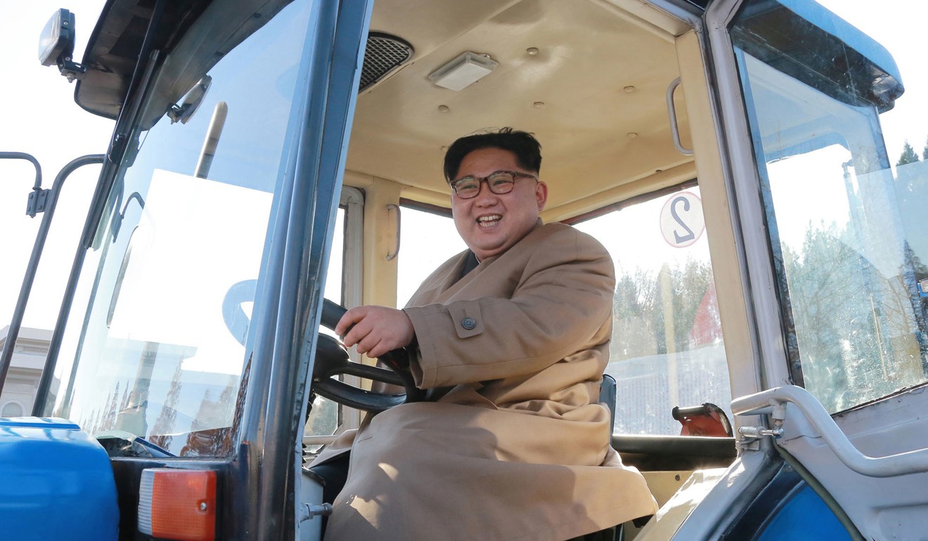 North Korean leader Kim Jong-un sits in a tractor at the Kumsong Tractor Factory, in Nampo, North Korea. Photo: Korean Central News Agency/Korea News Service via AP
