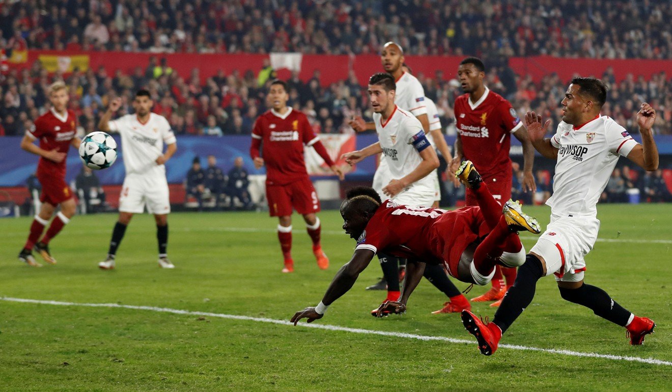 Sadio Mane makes it 2-0 to Liverpool with a diving header. Photo: Reuters
