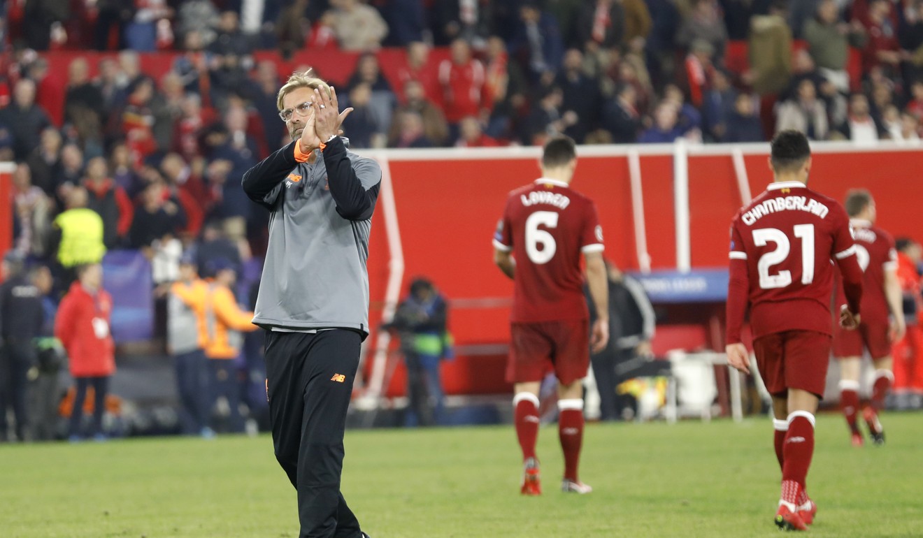 Jurgen Klopp applauds the Liverpool supporters as the players leave the pitch. Photo: AP