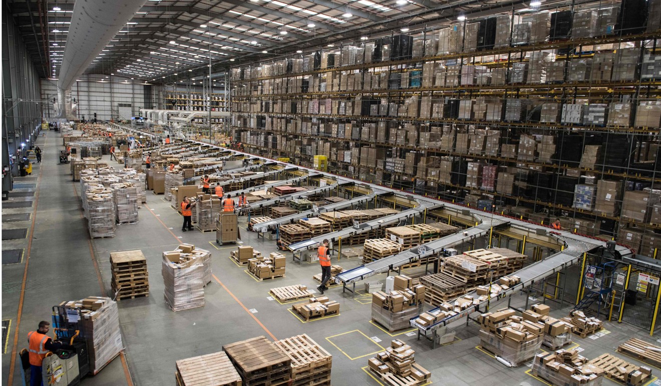 Workers prepare customer orders for dispatch at an Amazon warehouse in Britain. Photo: AFP