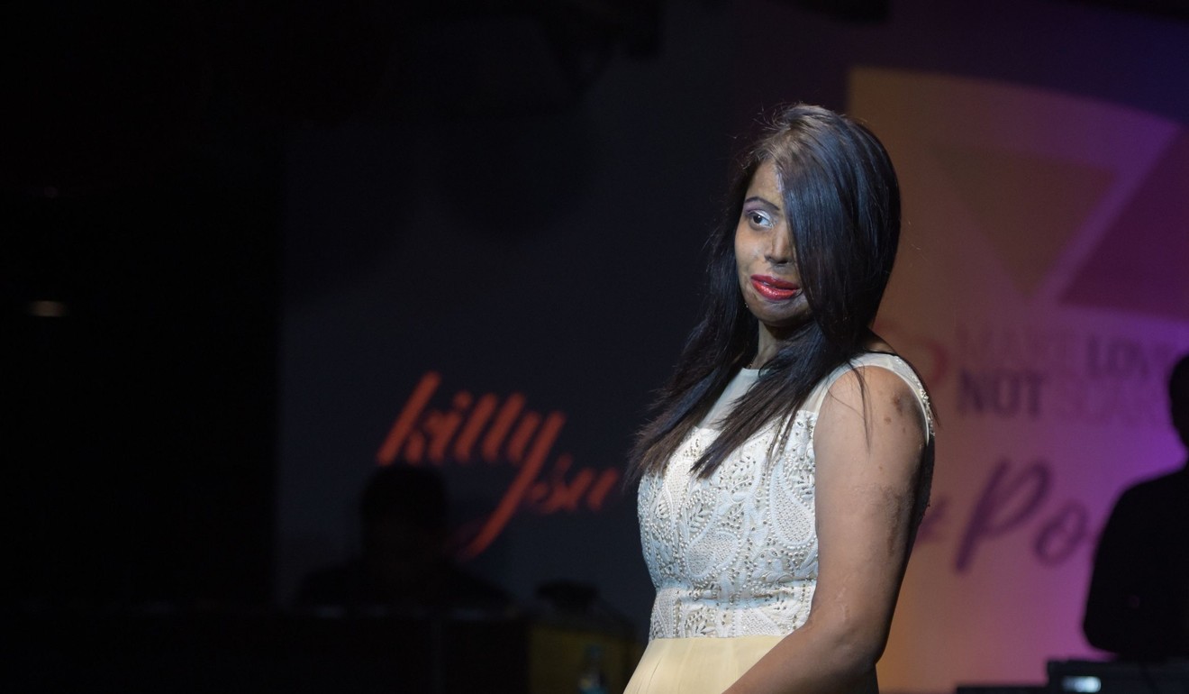 Indian acid attack survivor and model Mohini presents a creation by designer Sharu Arora. Photo: AFP