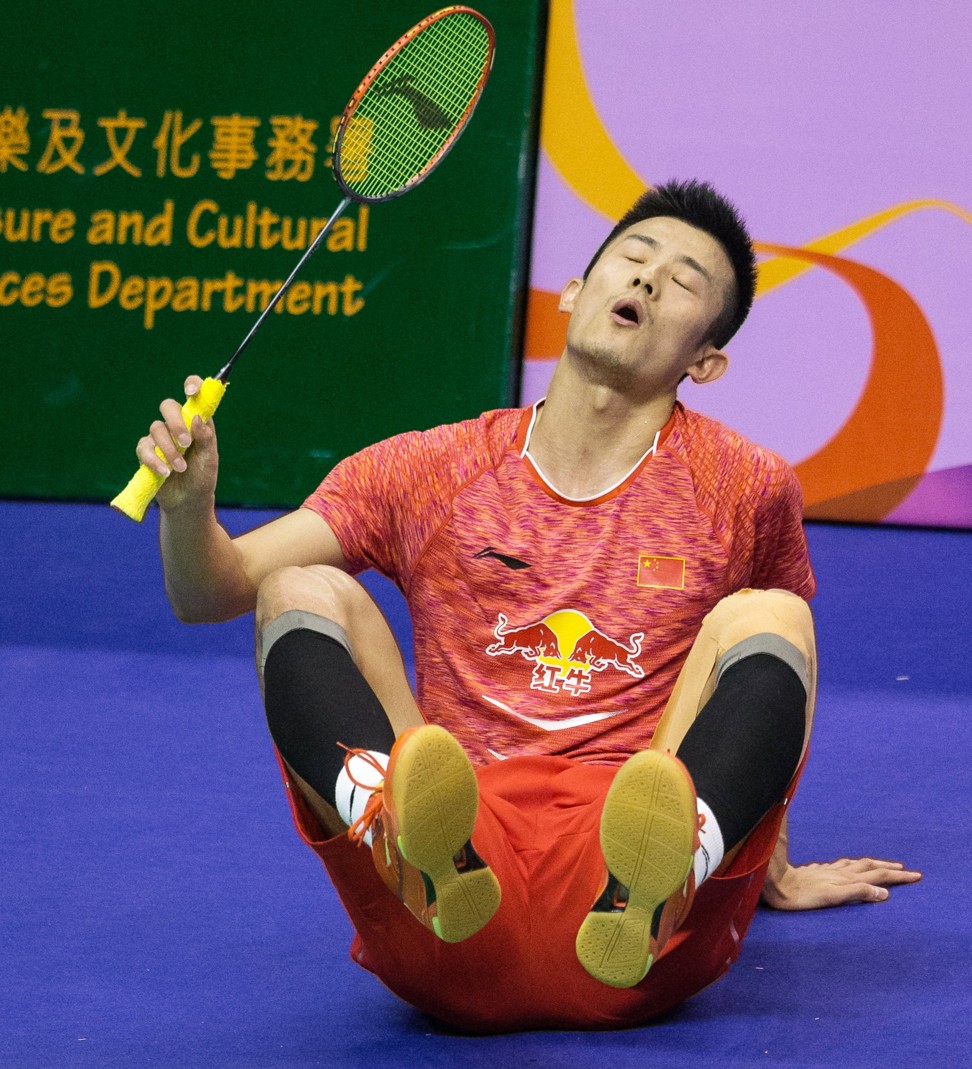 Chen Long takes a stumble during his match against Anders Antonsen. Photo: EPA