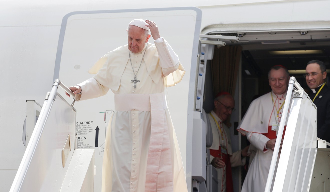 Pope Francis arrives at Yangon International Airport. Photo: Reuters