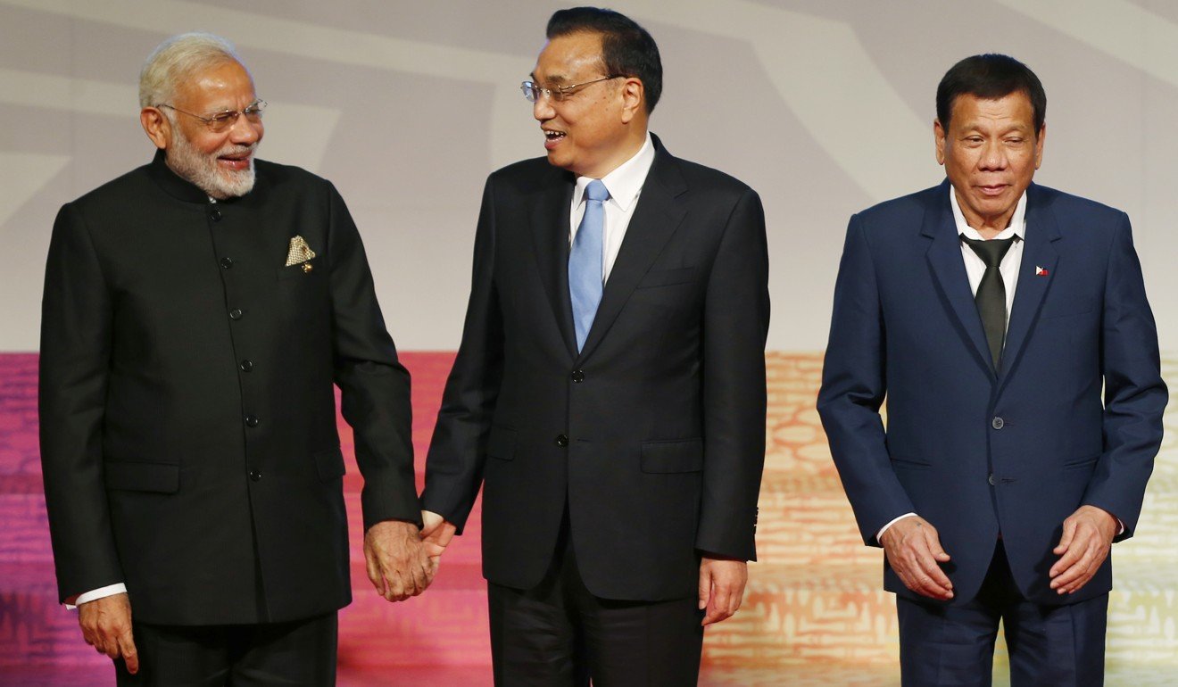 Indian Prime Minister Narendra Modi (left) greets Premier Li Keqiang (centre) as Philippine President Rodrigo Duterte (right) prepares to chair a meeting of the East Asia Summit in Manila. Beijing and New Delhi have long viewed each other with suspicion, as manifested by the stand-off on the Doklam plateau this year. Photo: AP