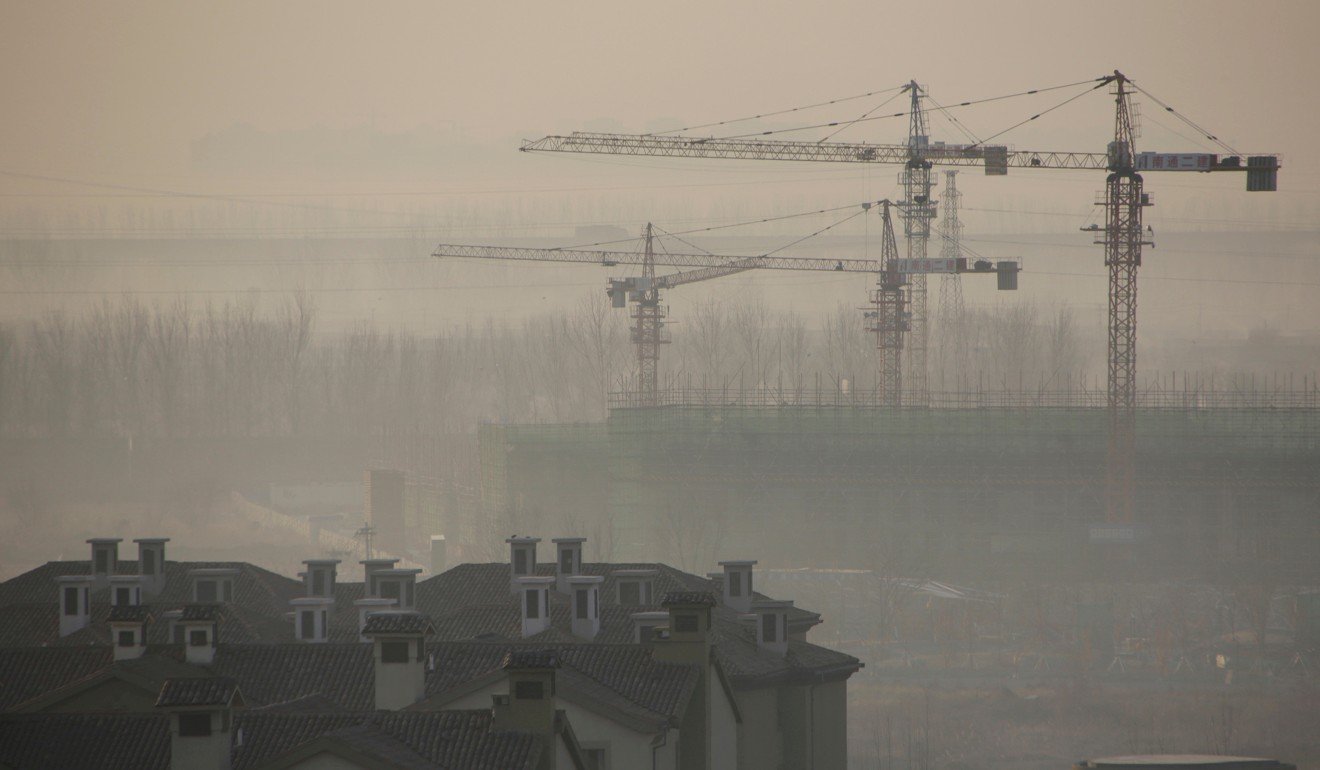 Apartment blocks are pictured next to a construction site in the Wuqing district of Tianjin. This time, the Chinese government is sincere about bursting the property bubble. But it can be successful only if an alternative and healthier growth model emerges. Photo: Reuters