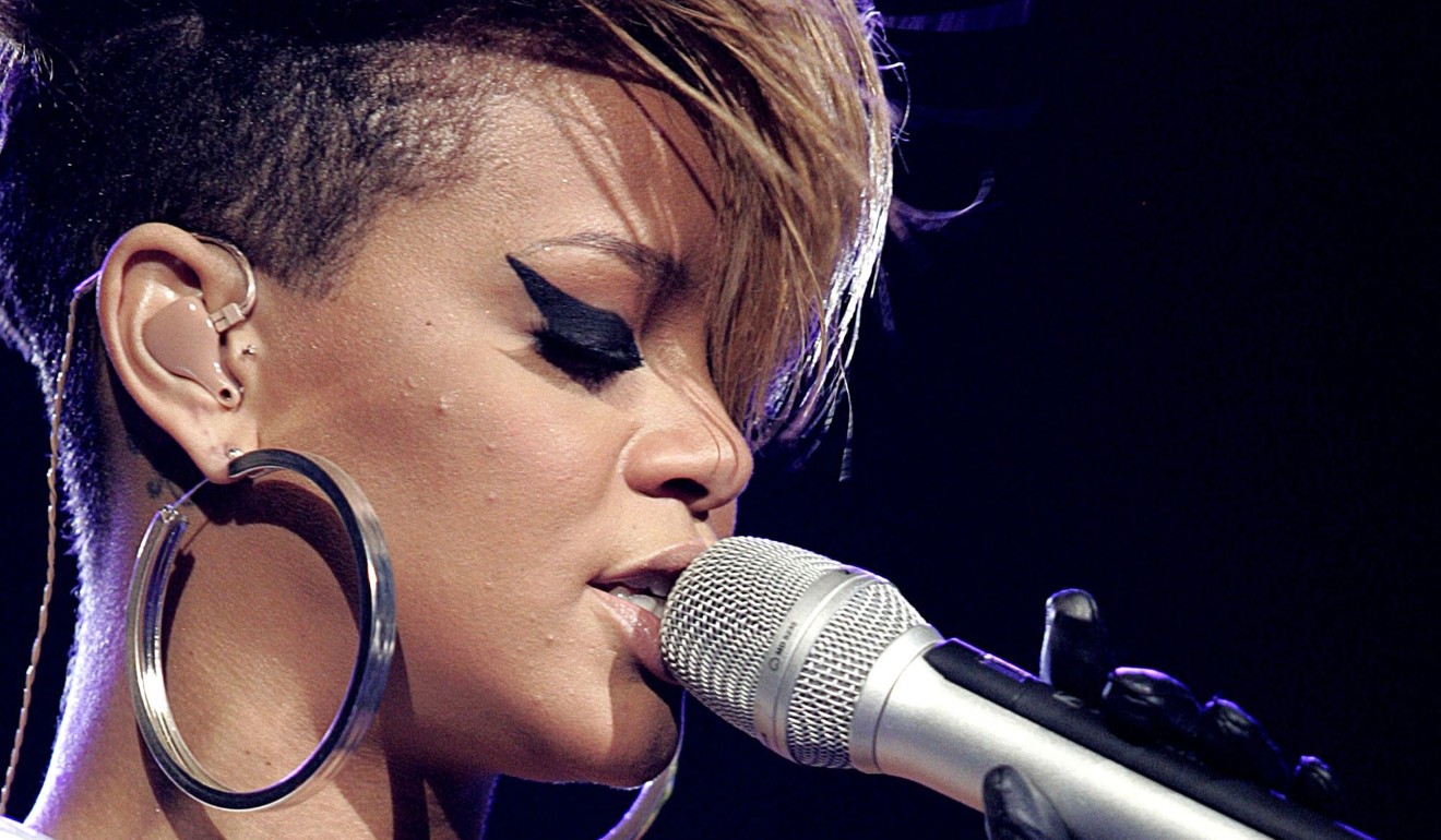 Rihanna rocks hoop earrings at a concert in Miami.