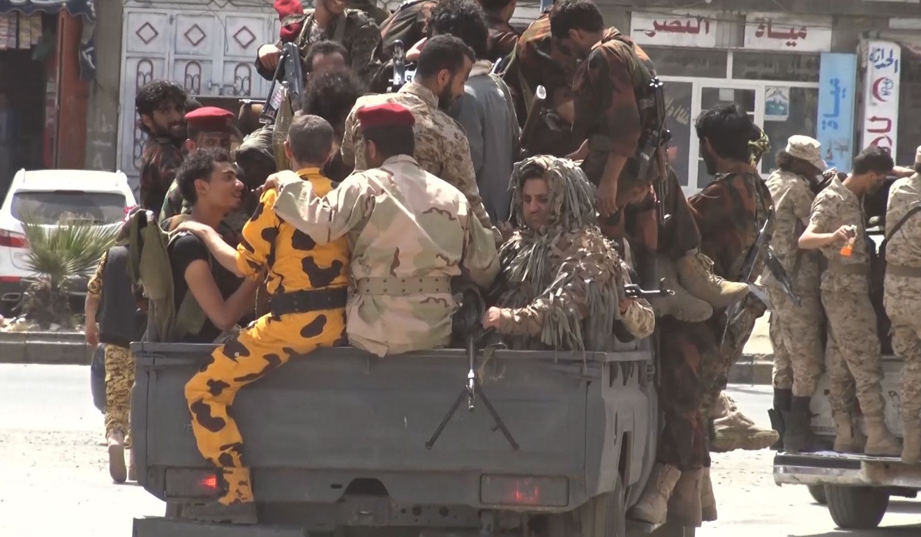 Houthi rebel fighters riding on the back of a truck in Sanaa. Photo: AFP