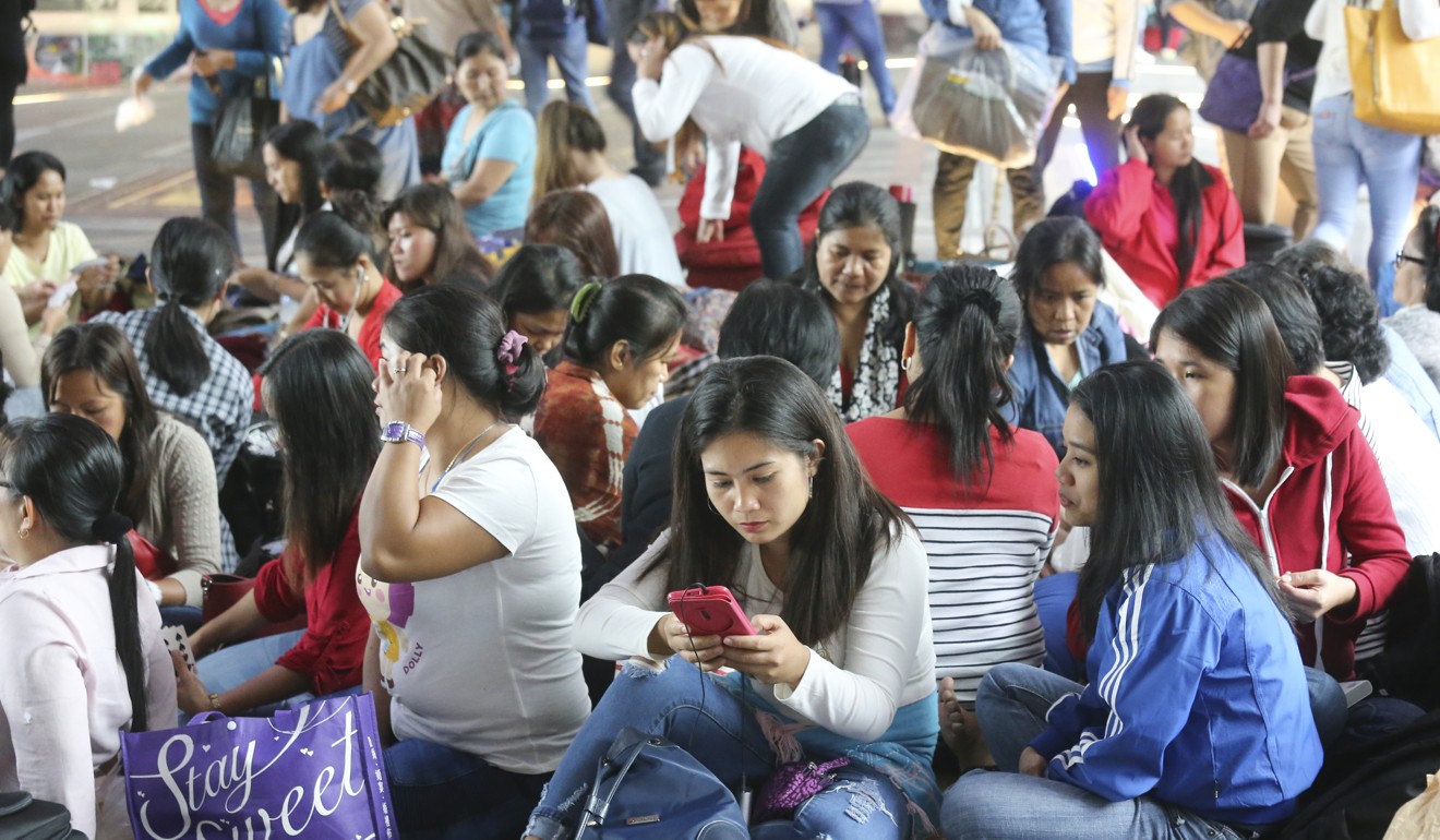Filipino domestic helpers gather on their day off in Central in October. Calls for more foreign domestic workers to take care of Hong Kong’s ageing population have led to concerns about how they are treated, but perhaps Hongkongers should ask whether more maids is the appropriate solution. Photo: Dickson Lee