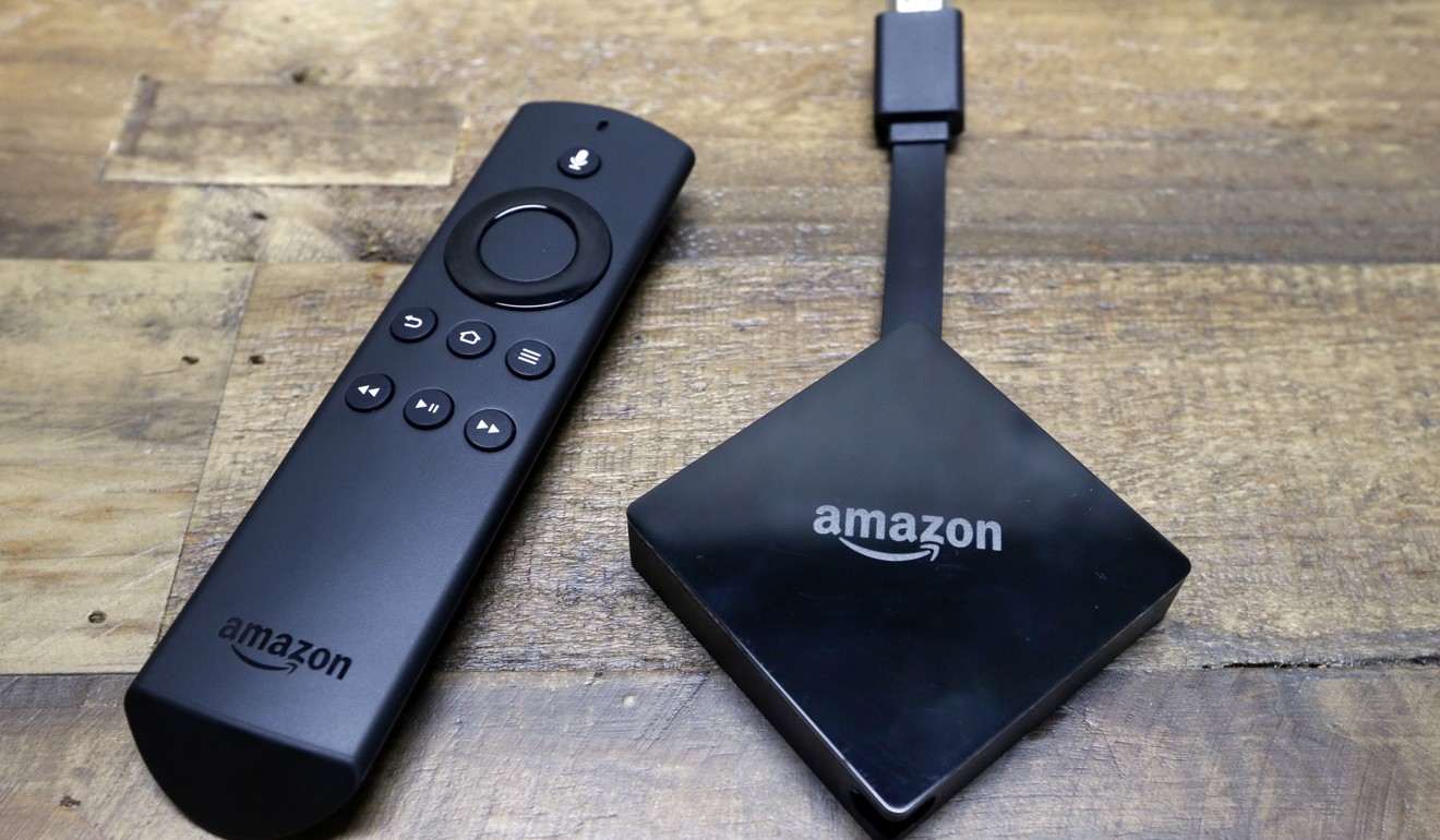 An Amazon Fire TV streaming device with its remote control. Photo: AP