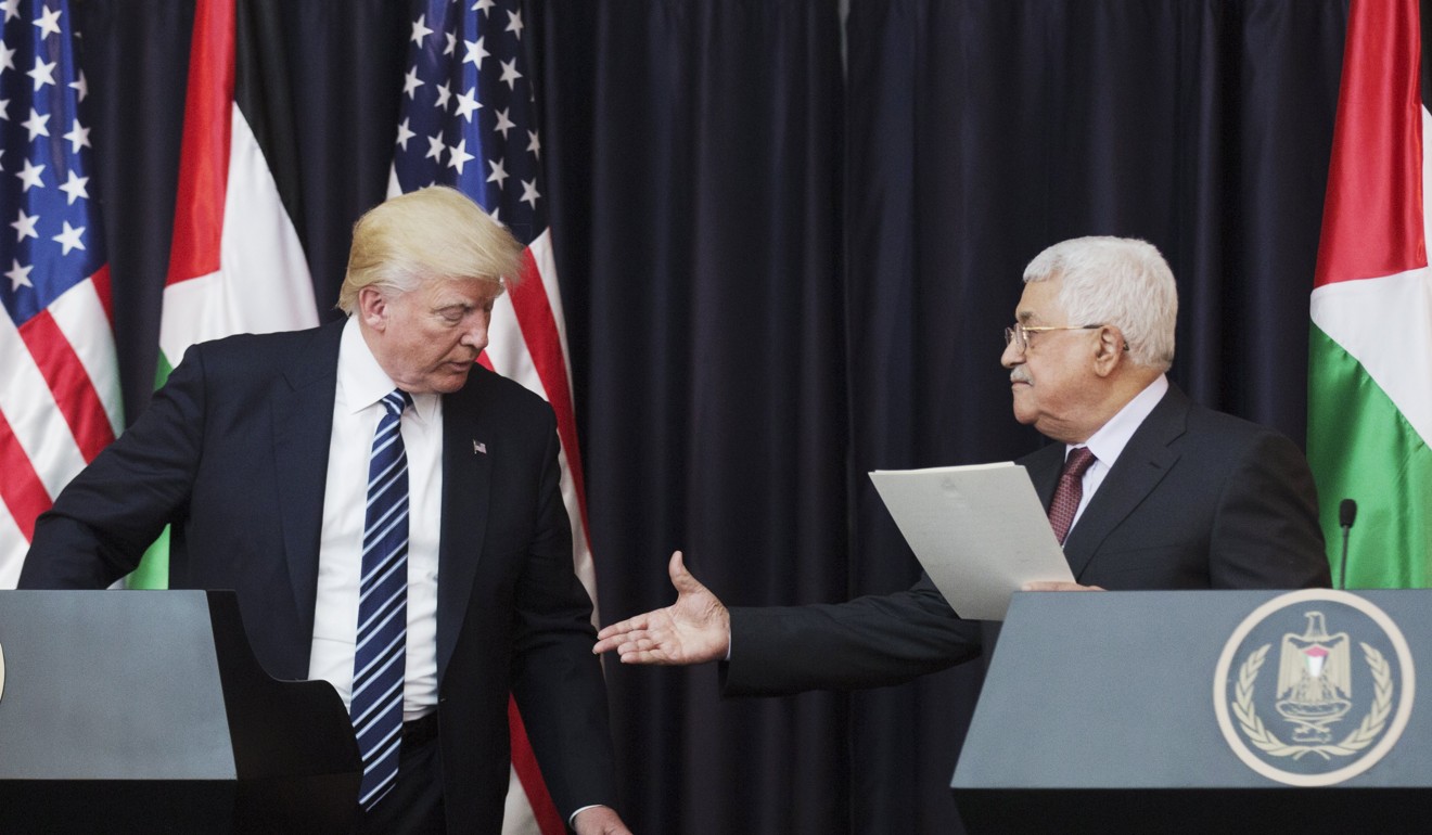 US President Donald Trump shakes hands with Palestinian President Mahmoud Abbas in Bethlehem, the West Bank in May. File photo: EPA